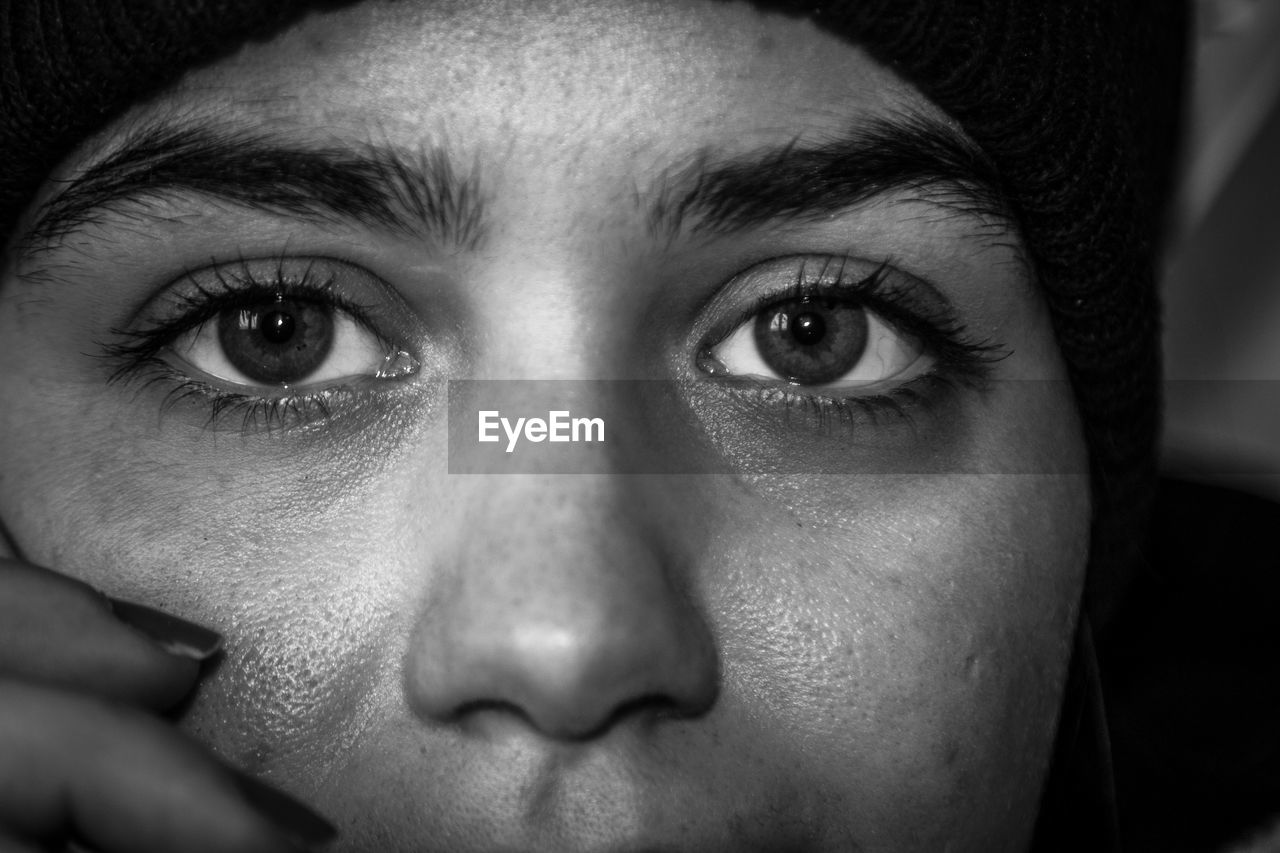 black, human face, portrait, one person, close-up, adult, human head, human eye, looking at camera, black and white, white, portrait photography, nose, young adult, monochrome, monochrome photography, headshot, emotion, eye, indoors, front view, person, women, darkness, skin, sadness, men, serious