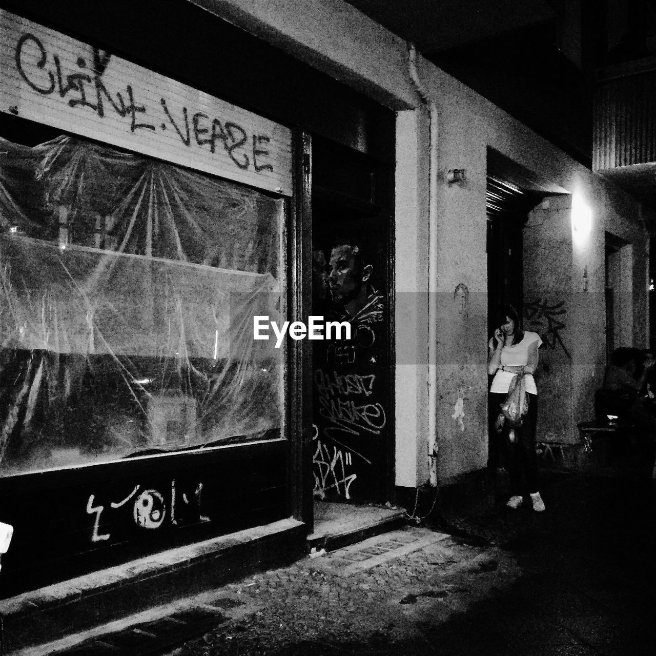 INFORMATION SIGN ON WALL AT NIGHT