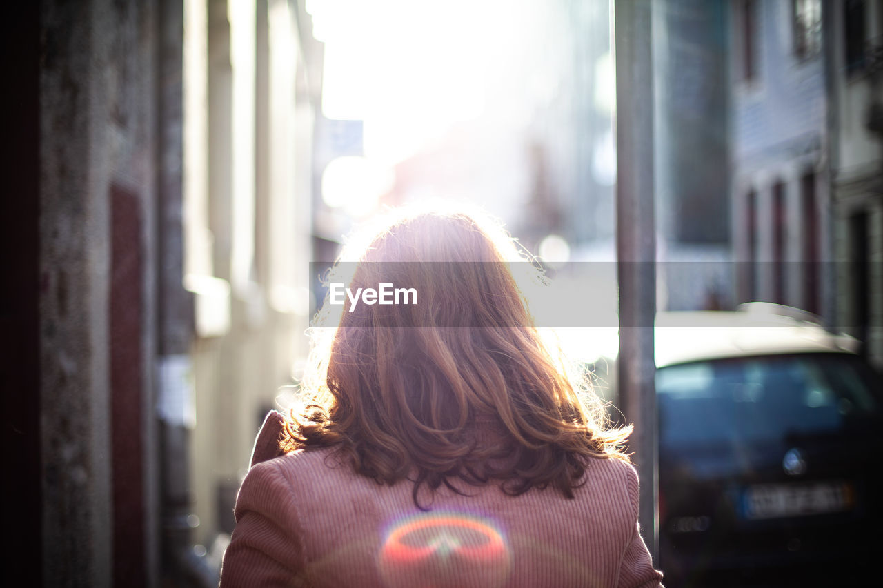 Rear view of woman walking in a city