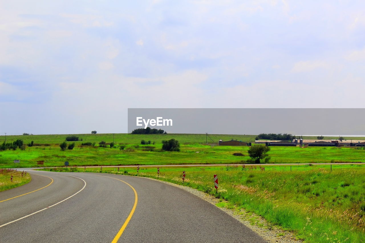 ROAD PASSING THROUGH FIELD