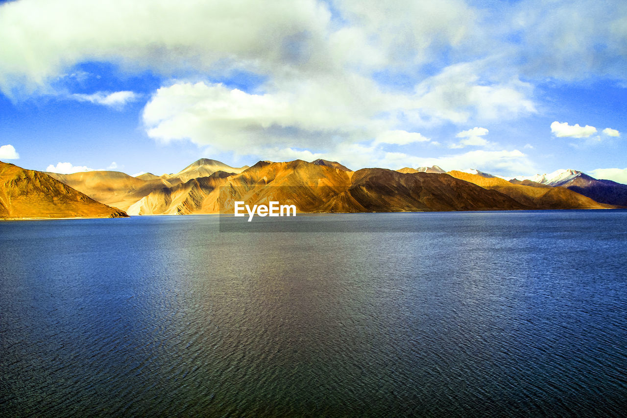 Scenic view of pangong tso and mountains against sky