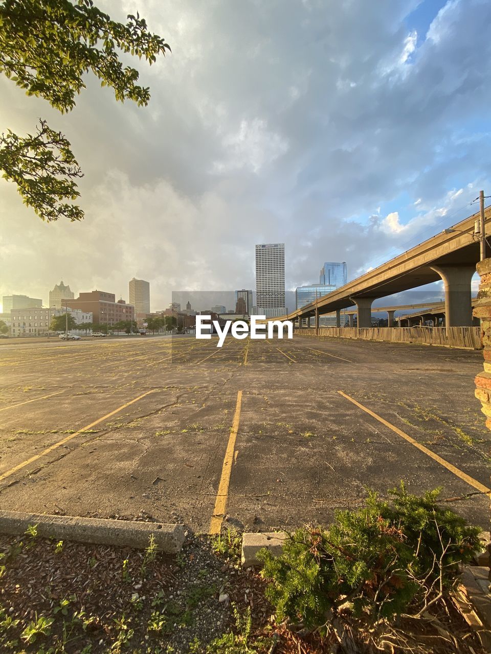 Surface level of road by buildings against sky