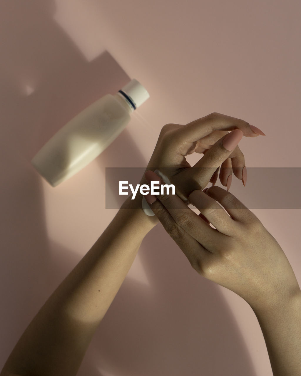 Women use body lotion for skincare in a new normal.