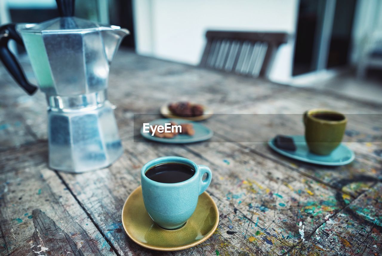 Close-up of coffee cup on table