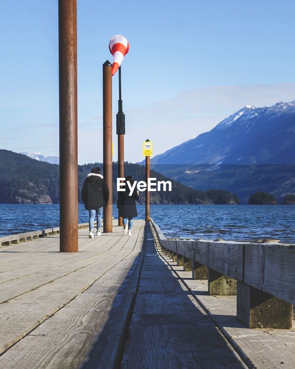 Pier over lake against sky