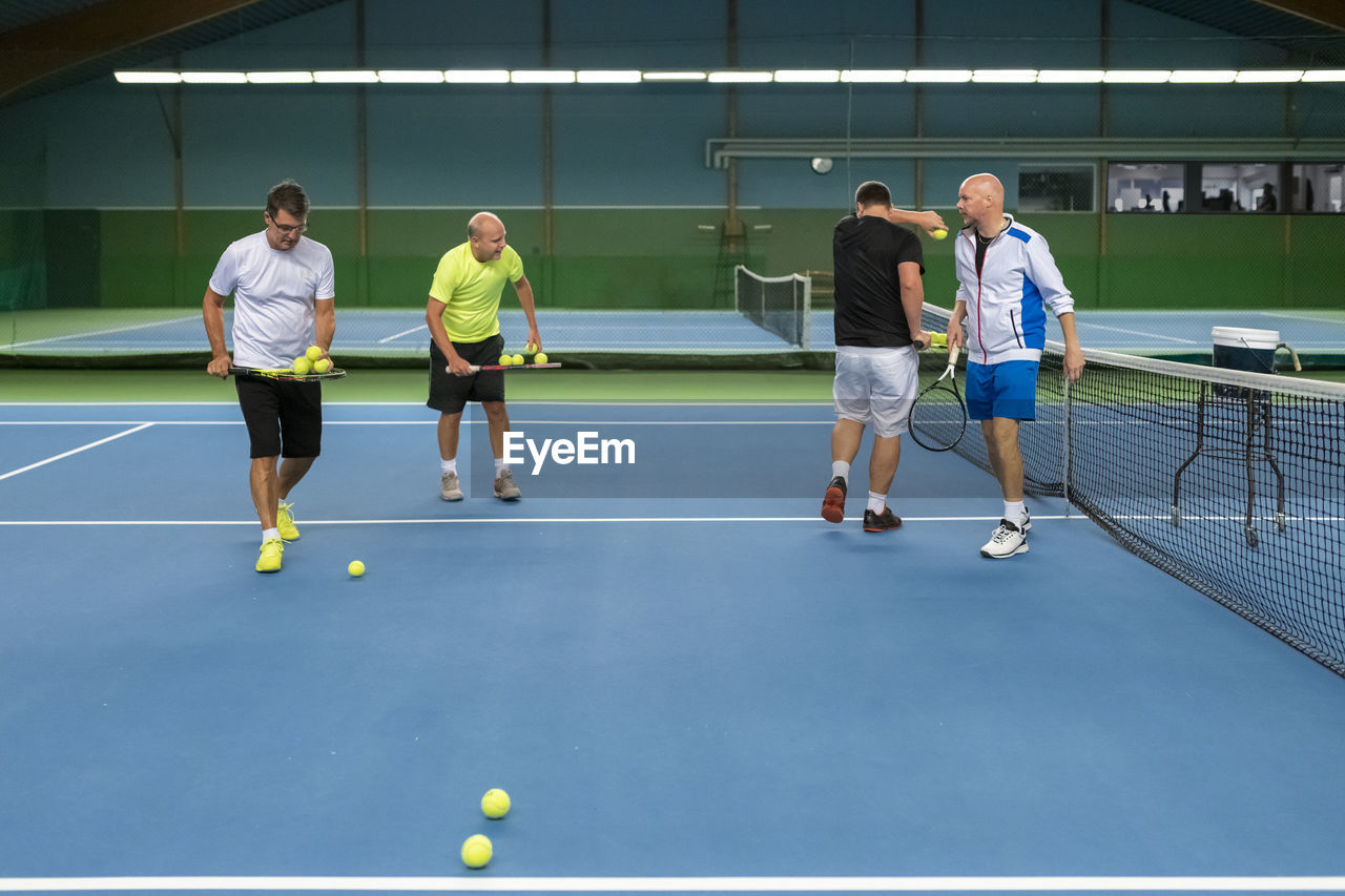 Men at tennis court