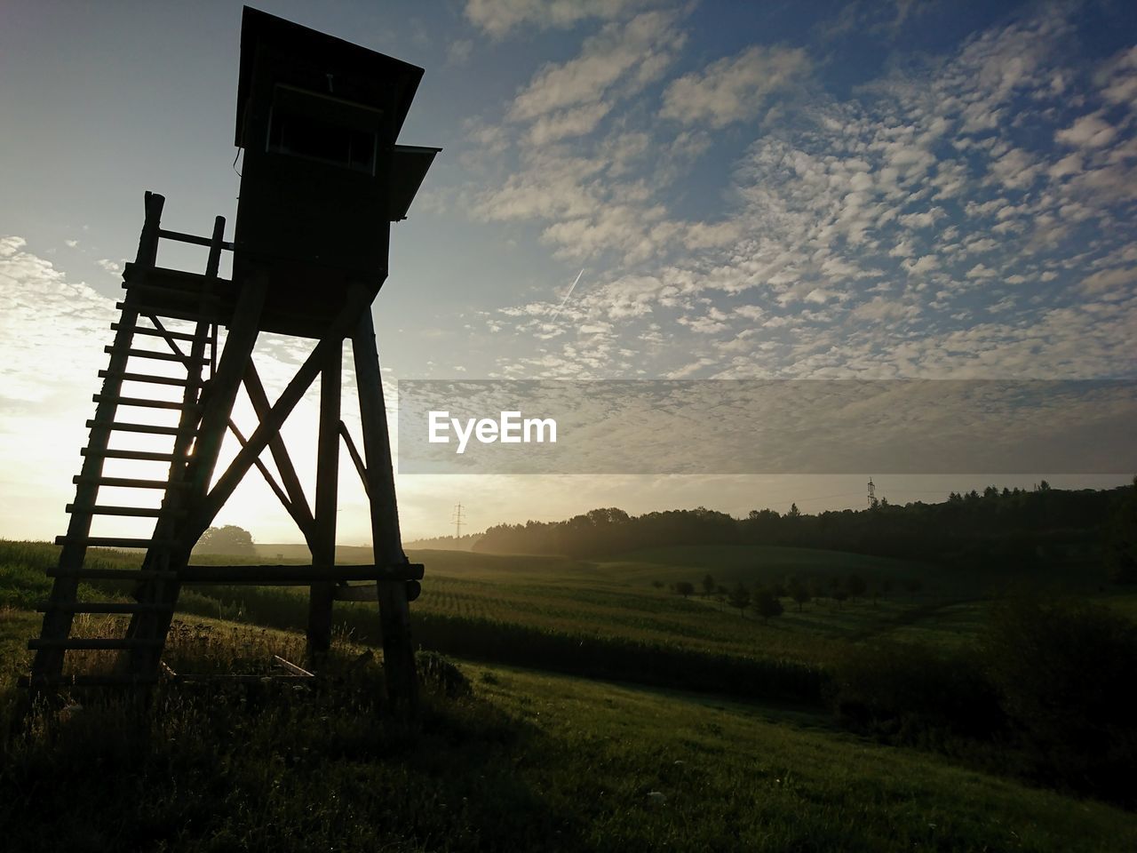 BUILT STRUCTURE ON FIELD AGAINST SKY