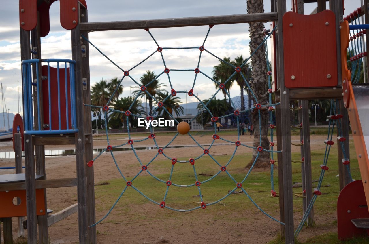 VIEW OF PLAYGROUND AGAINST SKY