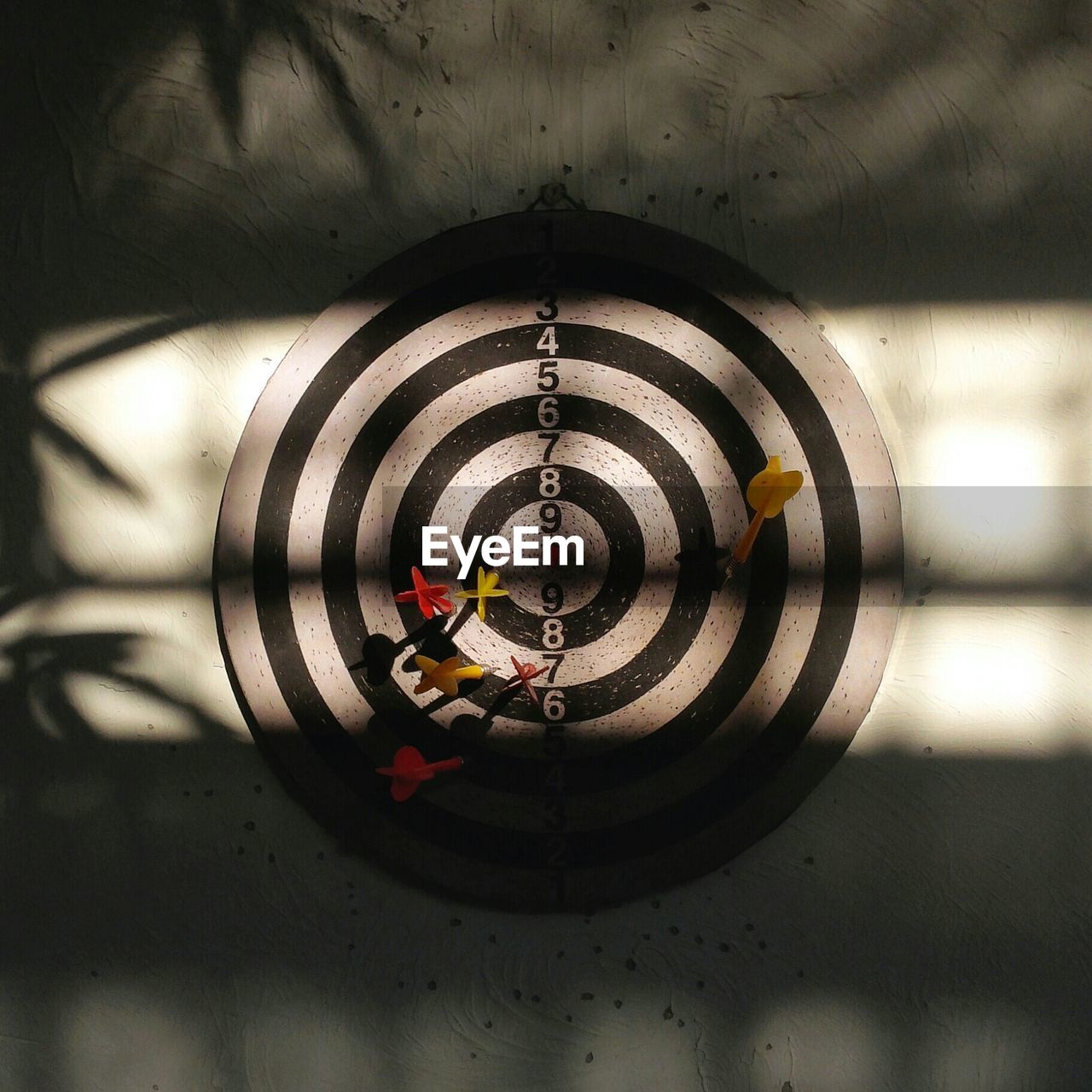View of darts in dartboard
