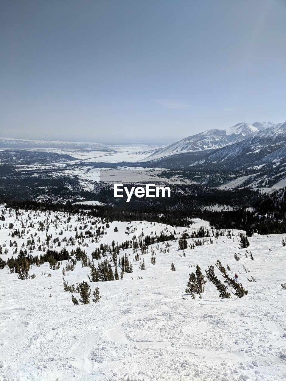 Scenic view of snow covered field against sky