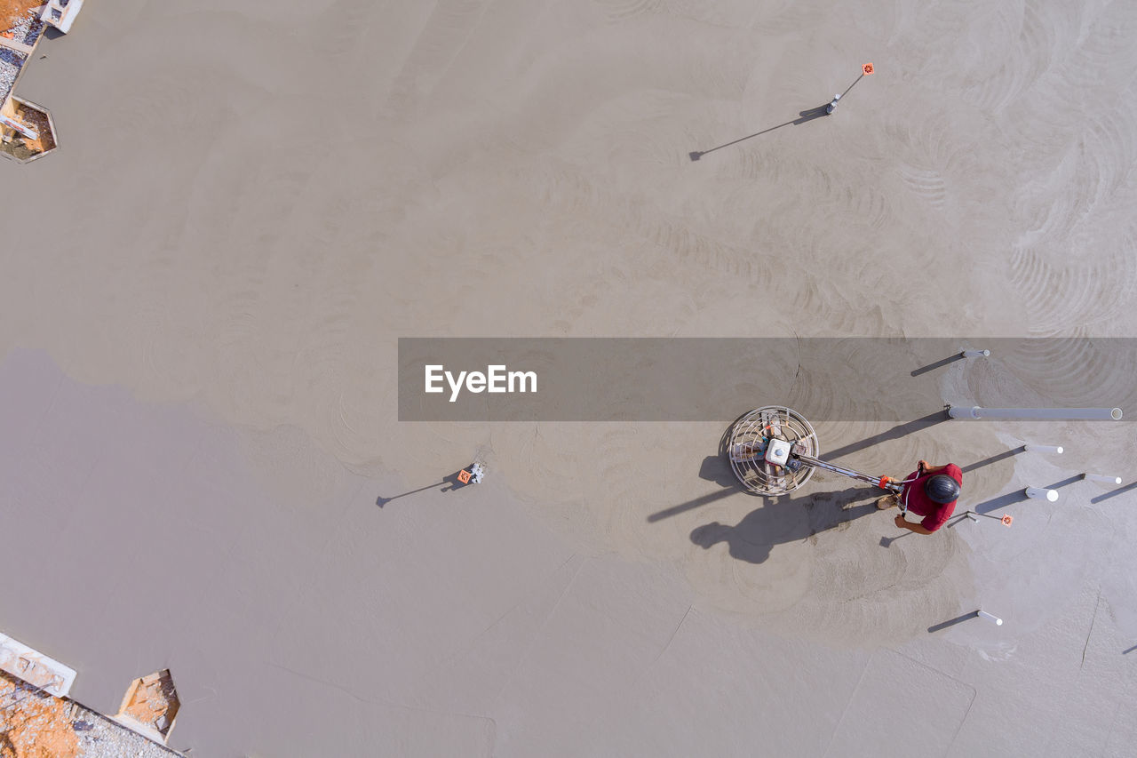 high angle view of people walking on beach