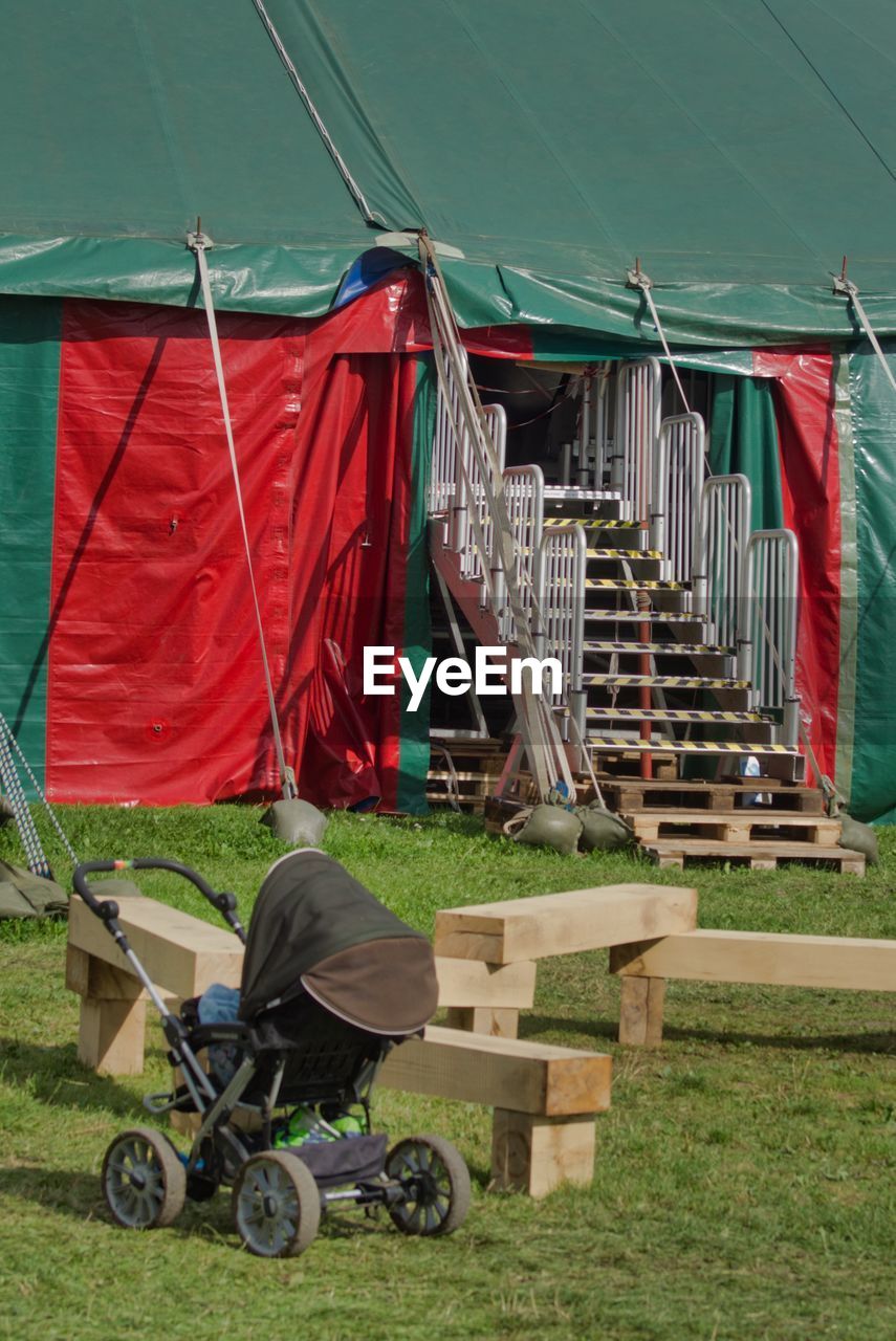 SHOPPING CART IN FRONT OF TENT