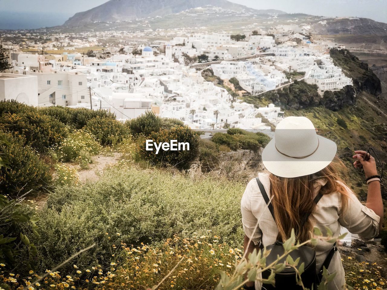 Rear view of woman looking at townscape