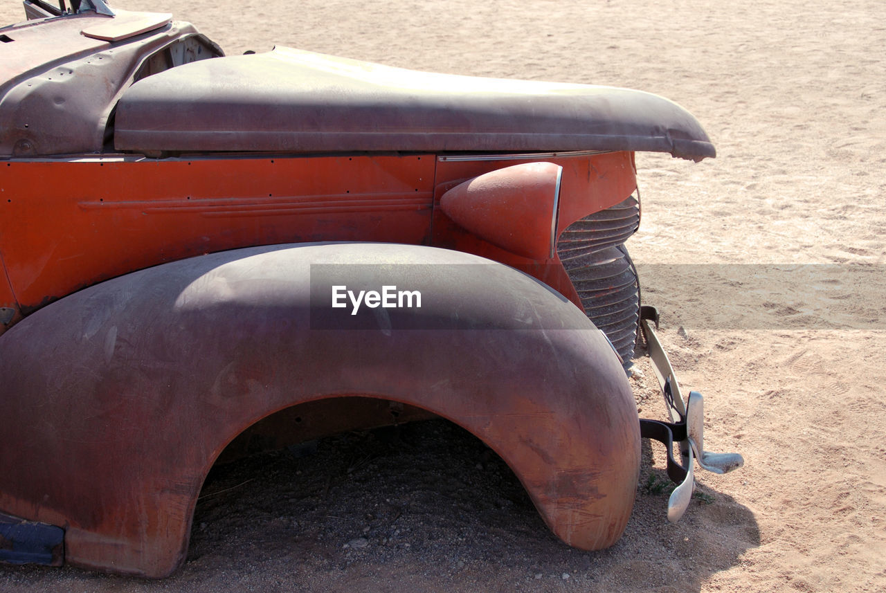 CLOSE-UP OF CAR ON ROAD