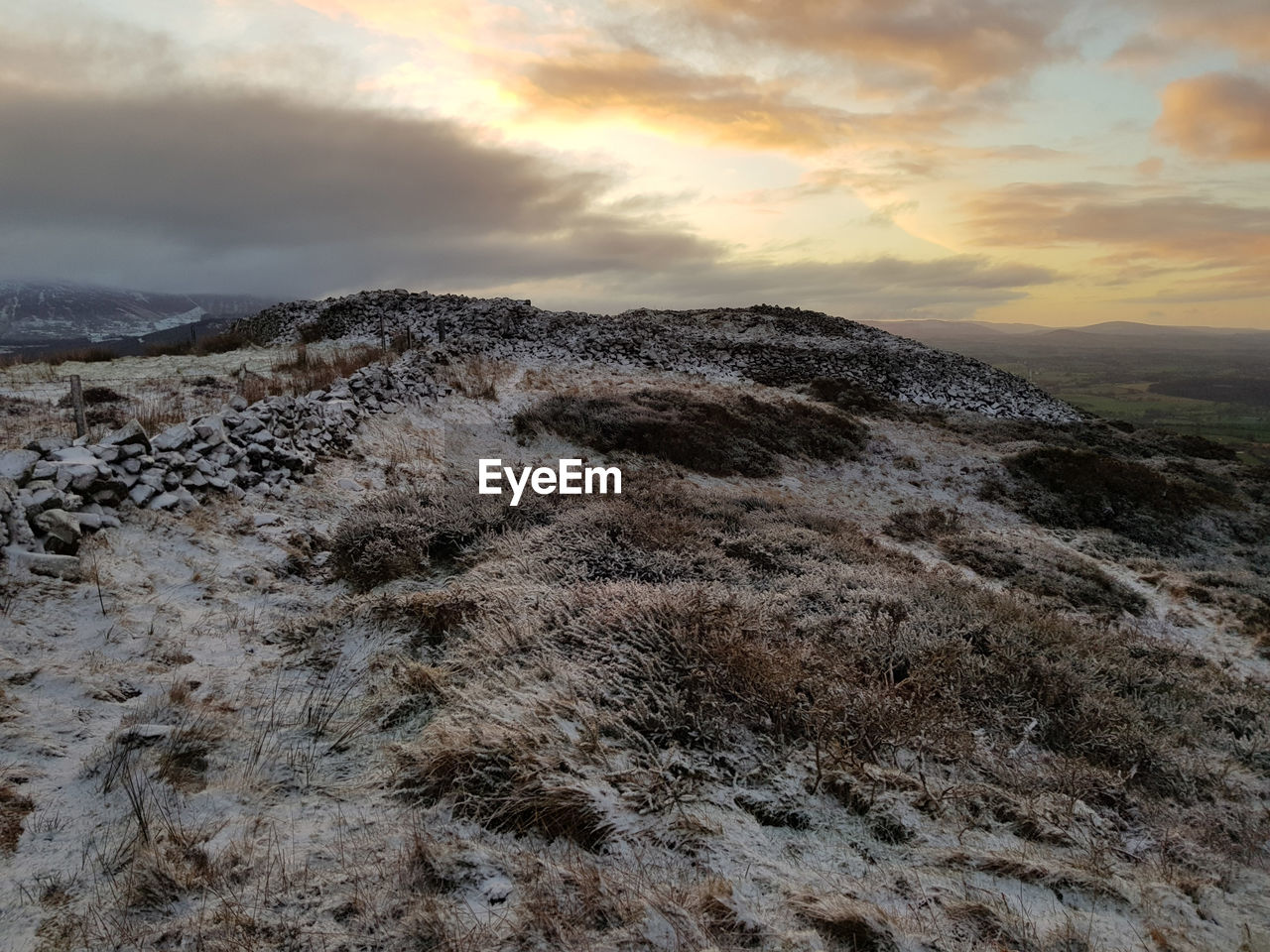 Scenic view of landscape against sky during sunset