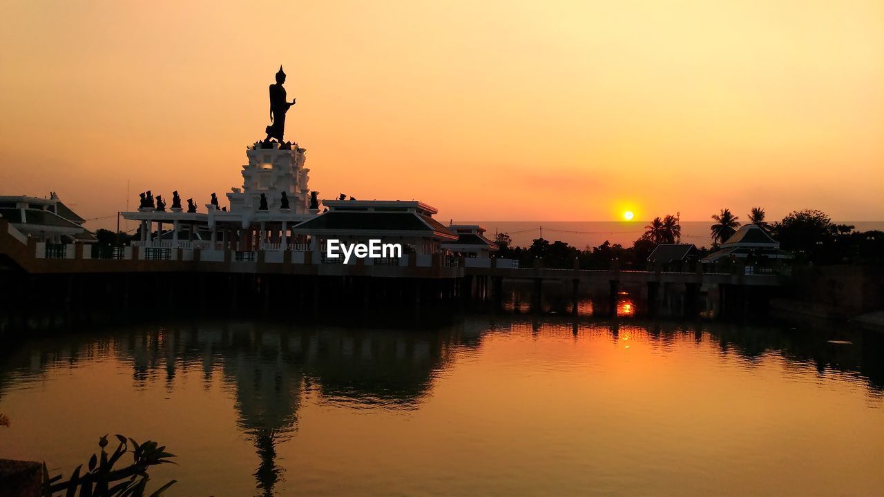 Silhouette of building at sunset