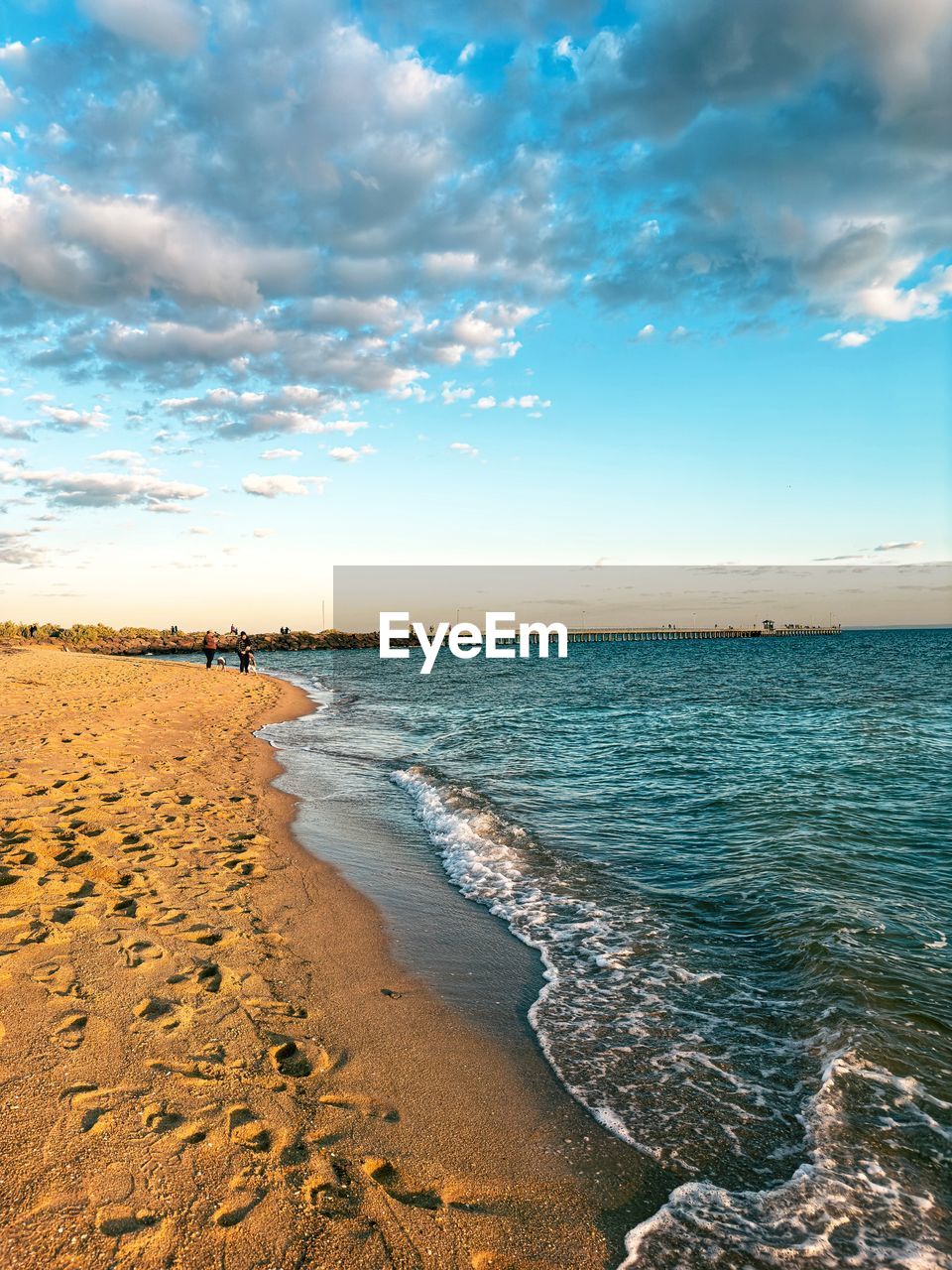 scenic view of beach against sky during sunset