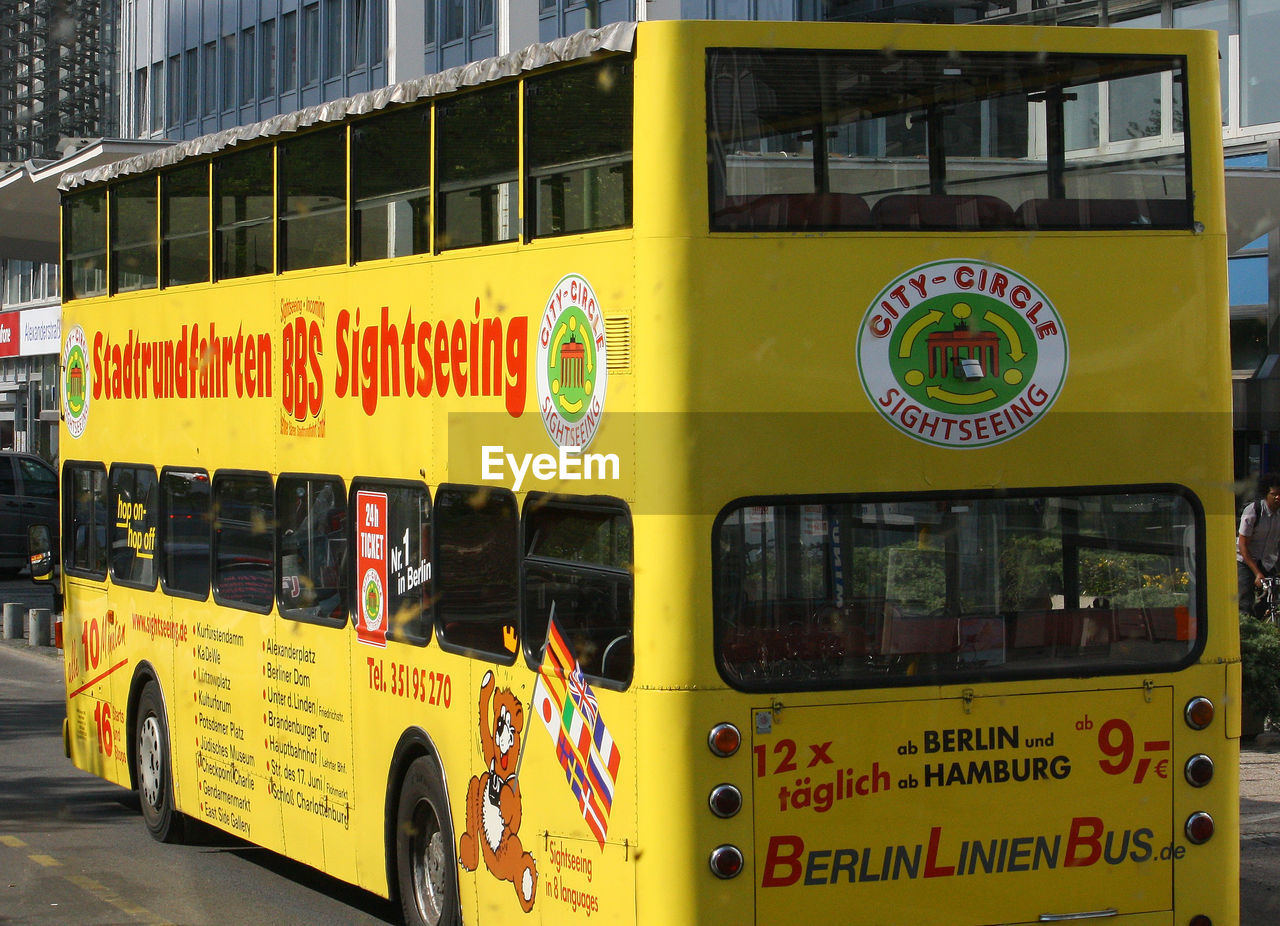 CLOSE-UP OF YELLOW TEXT ON CAR