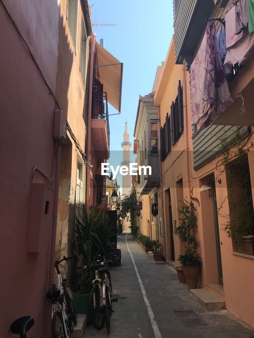 Street amidst buildings against sky in city