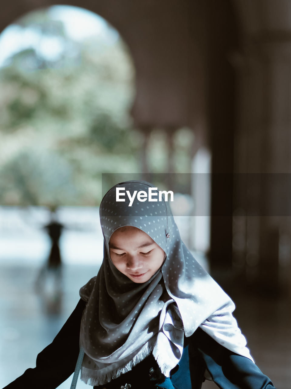 one person, clothing, hood, hood - clothing, adult, female, portrait, architecture, hijab, hooded shirt, lifestyles, child, person, headscarf, women, childhood, winter, young adult, looking, outdoors, men, city, religion, emotion, front view, nature, focus on foreground, day, human face, spring, cold temperature, serious