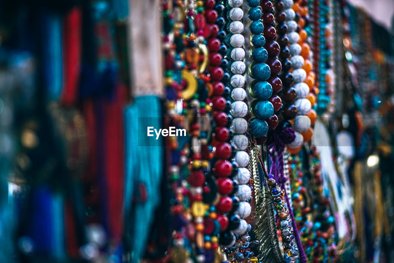 Close-up of multi colored jewelry at market stall