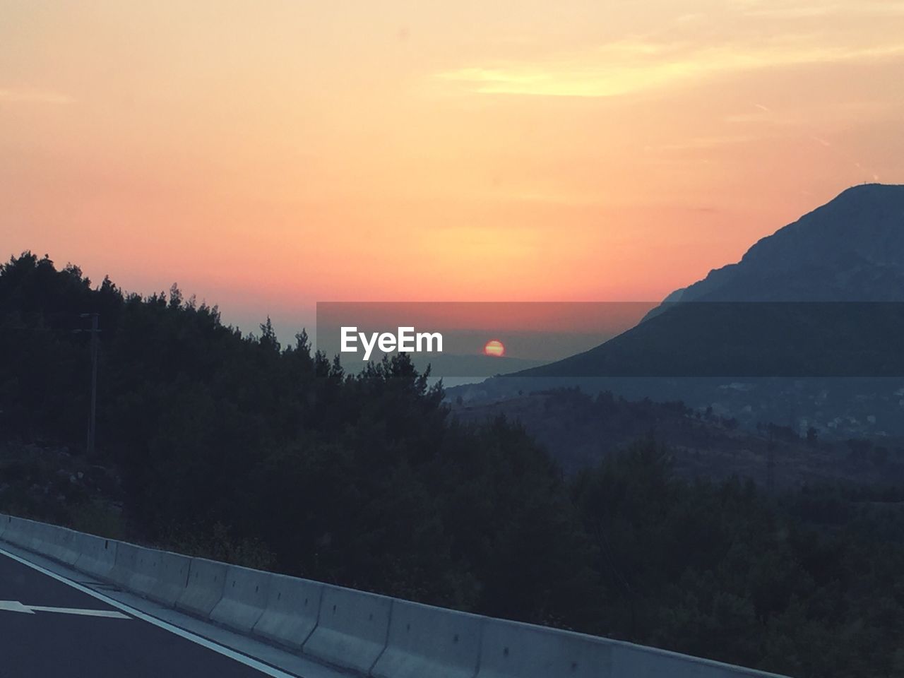 SCENIC VIEW OF MOUNTAINS DURING SUNSET