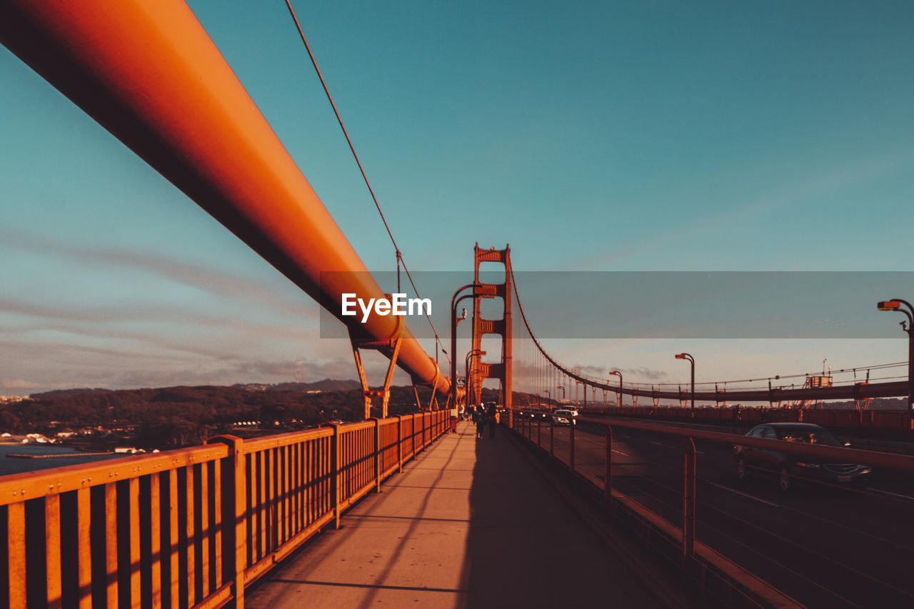 View of suspension bridge against sky during sunset