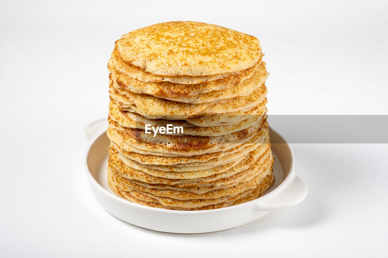 food and drink, food, dish, meal, white background, breakfast, pancake, freshness, studio shot, sweet food, indoors, plate, baked, no people, dessert, bread, healthy eating, cut out, snack, still life