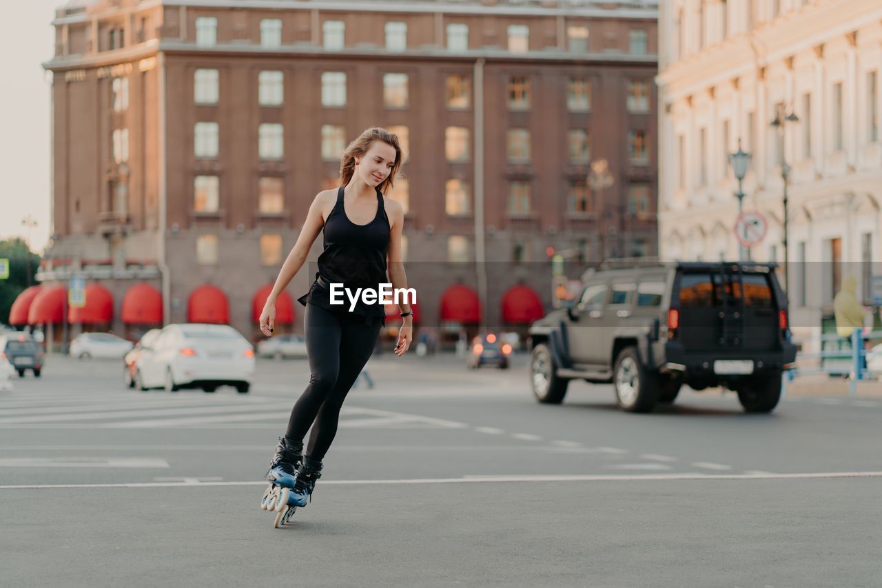 WOMAN ON STREET IN CITY