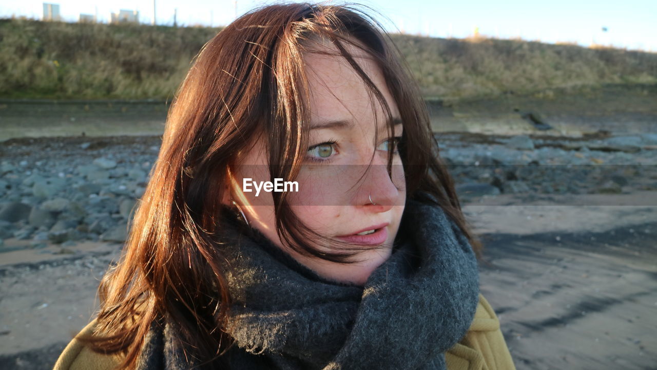 Close-up of beautiful young woman at beach