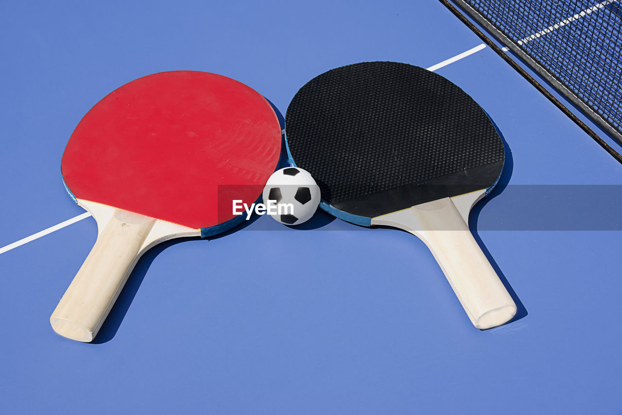 Close-up of tennis rackets on table