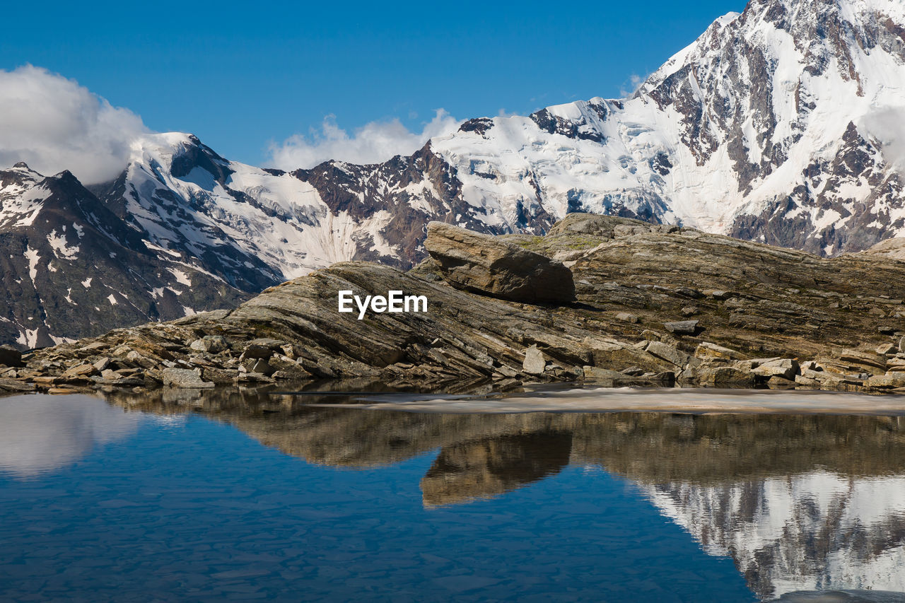 View of lago smeraldo and monte rosa in valle anzasca, piedmont, italy