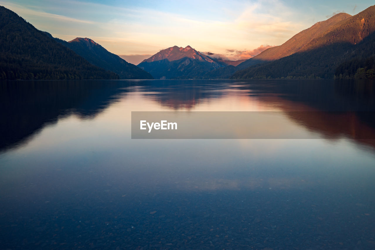 Sunset on lake crescent with mountains in background