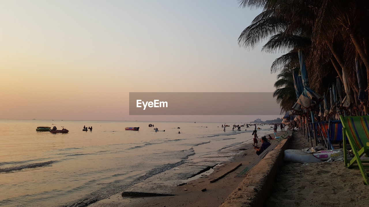 Scenic view of beach against sky during sunset