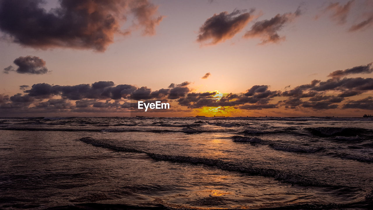 SCENIC VIEW OF SEA DURING SUNSET