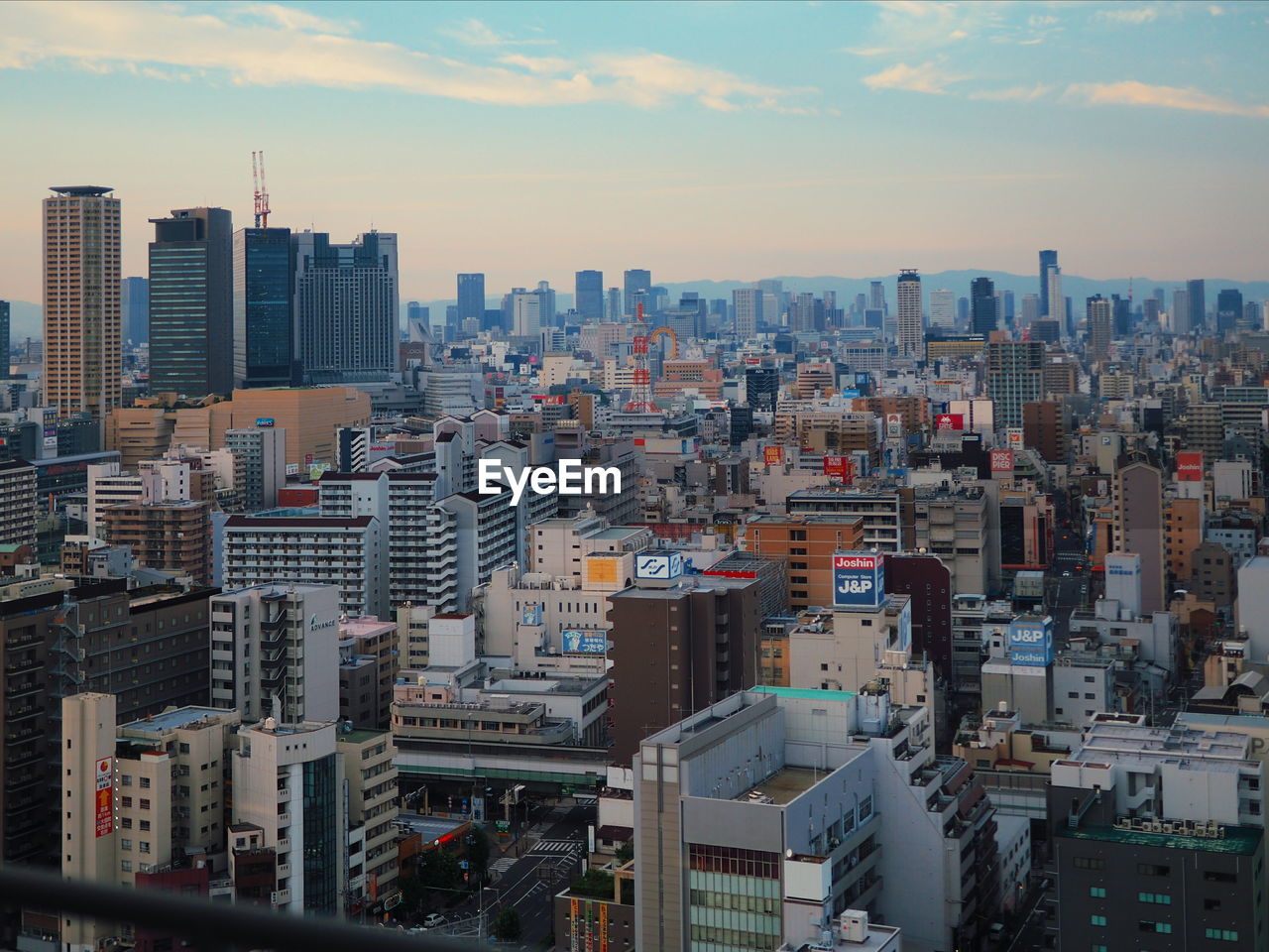 Cityscape against sky during sunset