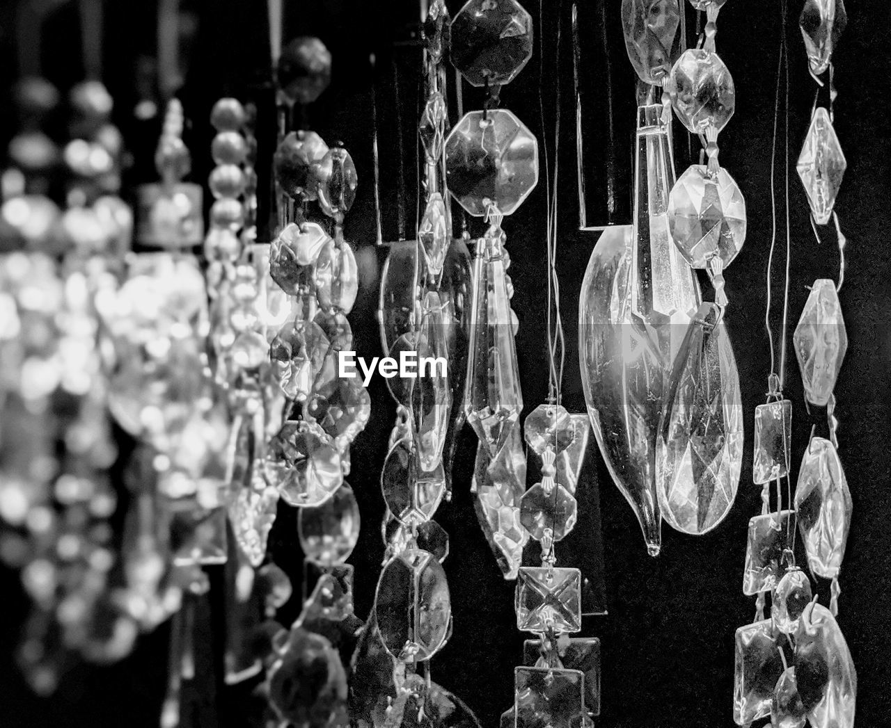 Close-up of chandelier against black background