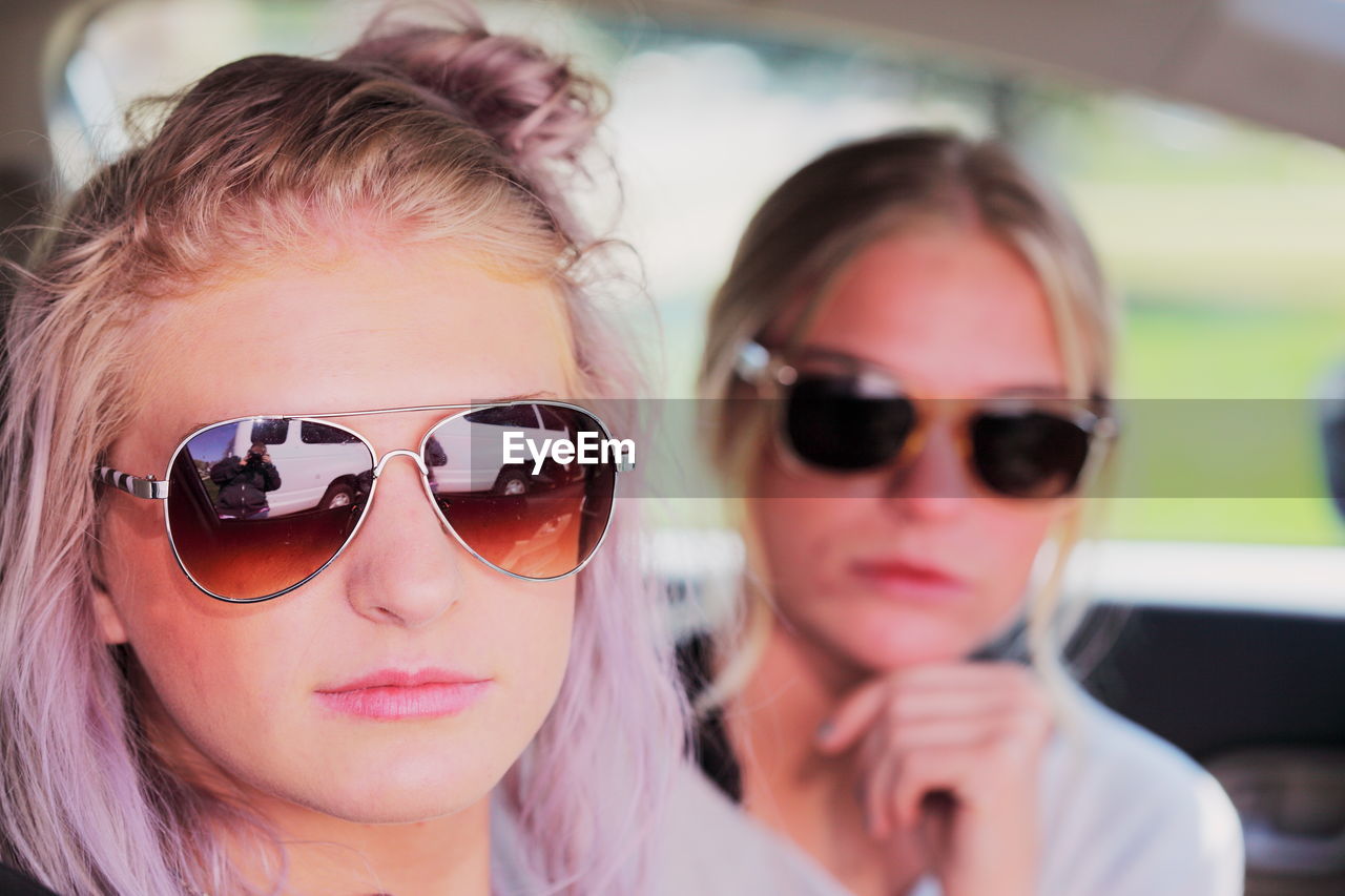 Portrait of young women in car