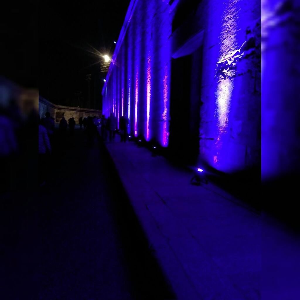 ILLUMINATED ROAD IN CITY AT NIGHT