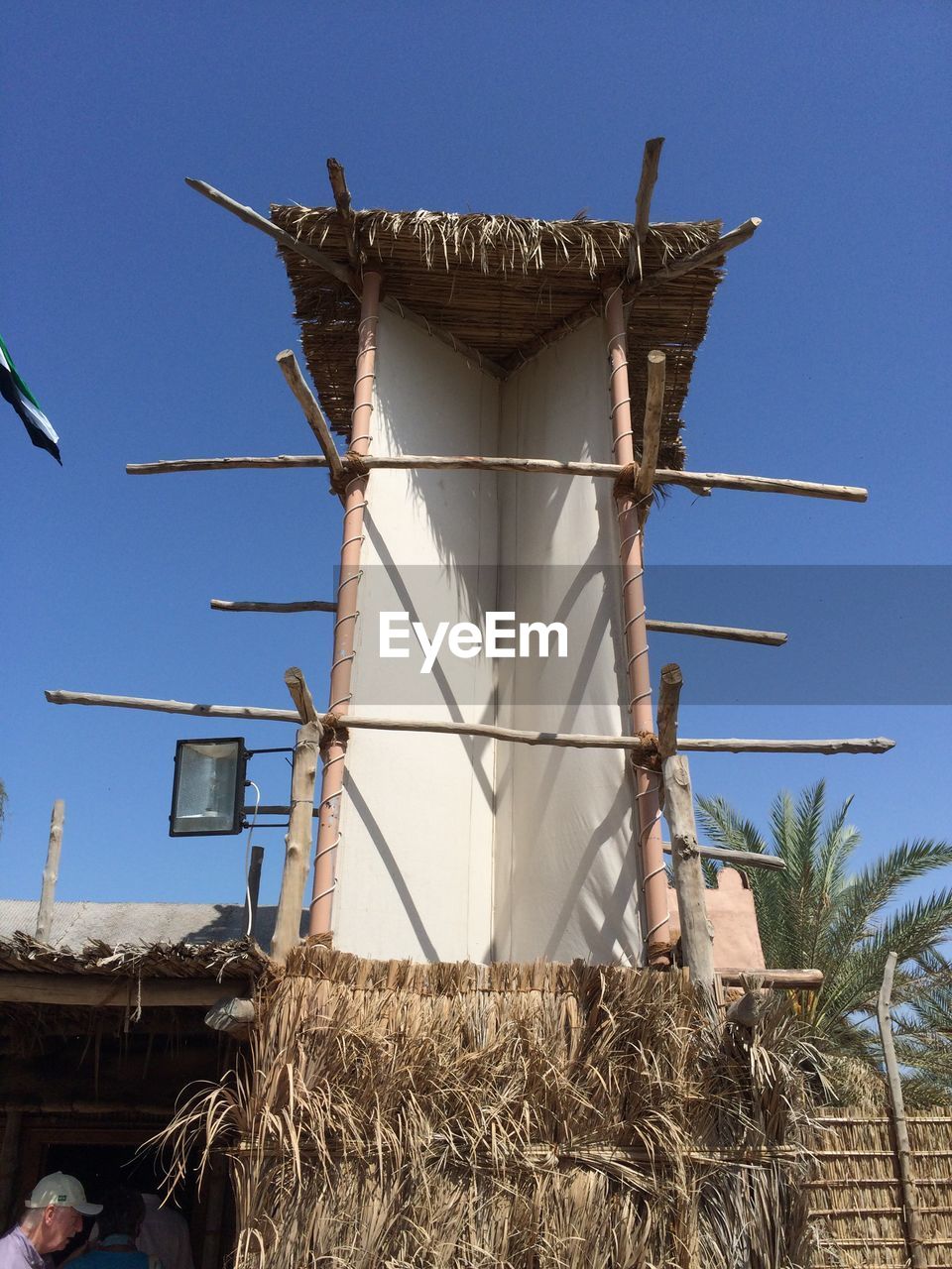 LOW ANGLE VIEW OF BUILT STRUCTURES AGAINST BLUE SKY