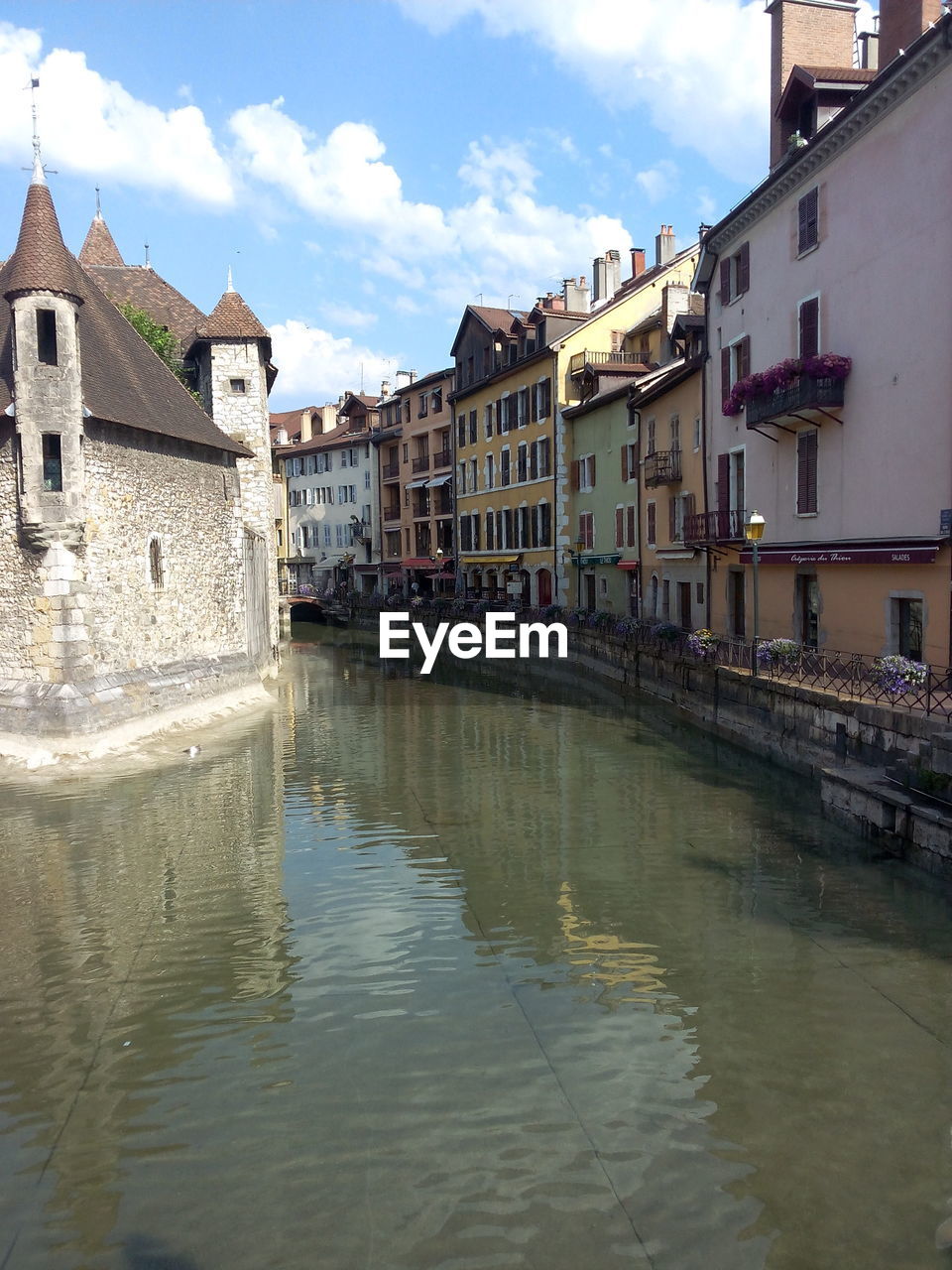 CANAL BY BUILDINGS IN CITY