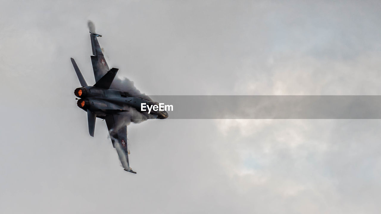 LOW ANGLE VIEW OF AIRPLANE IN SKY