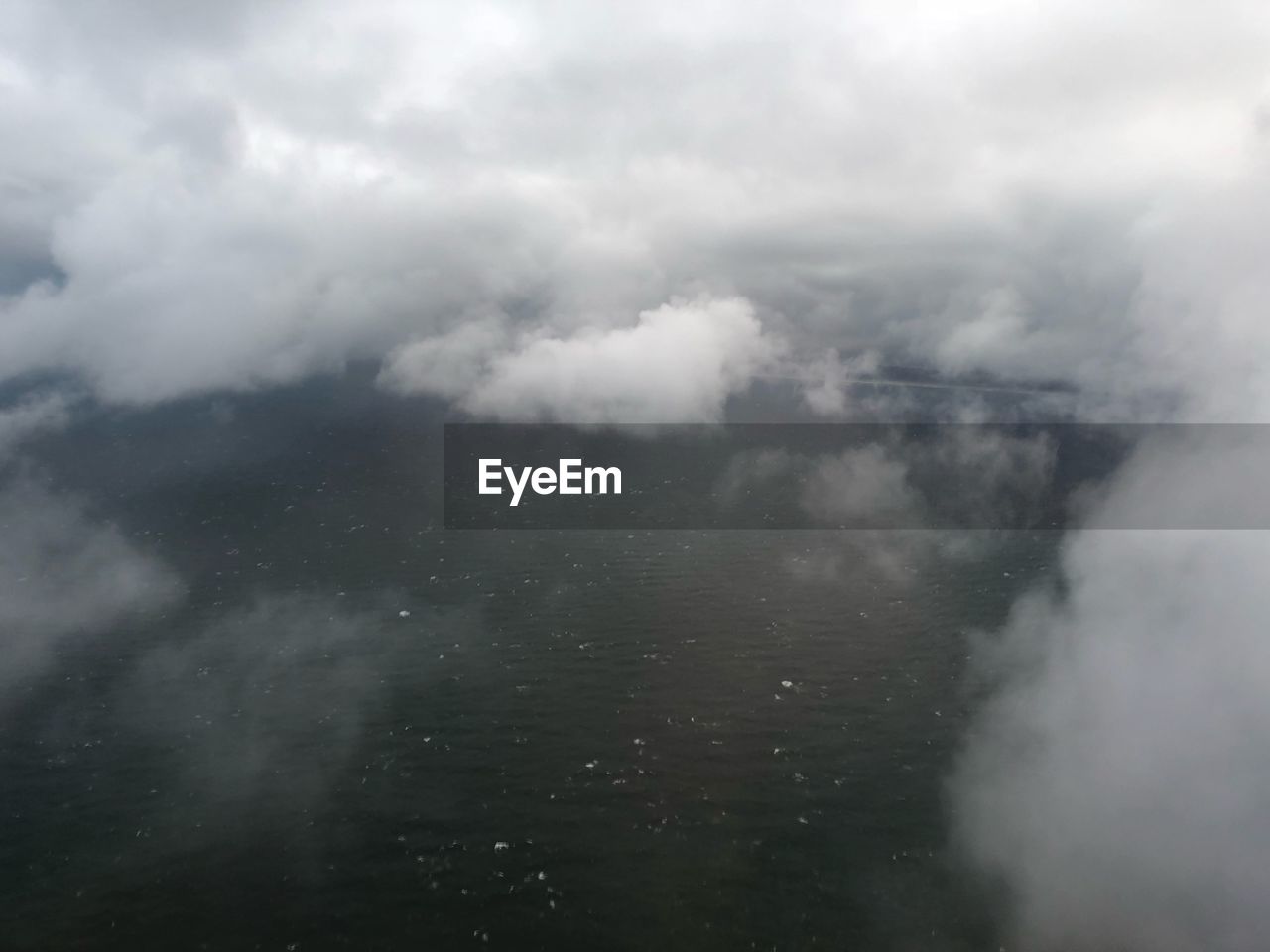 AERIAL VIEW OF CLOUDS OVER LANDSCAPE