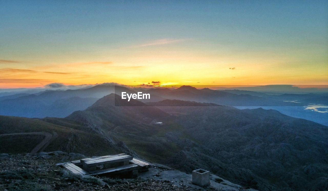 Scenic view of mountains against sky during sunset