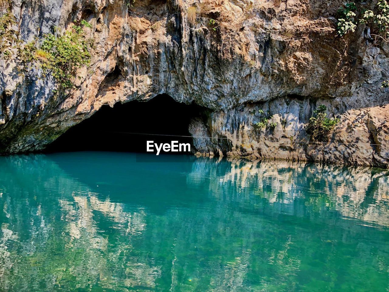 Scenic view of rock formation in lake