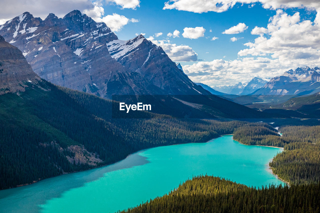 Scenic view of peyto lake with snowcapped mountains