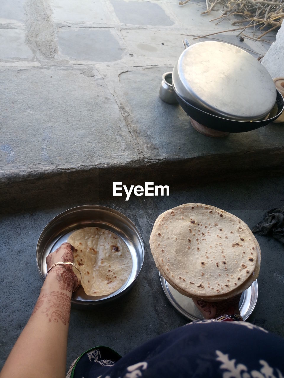 Cropped image of woman holding chapattis