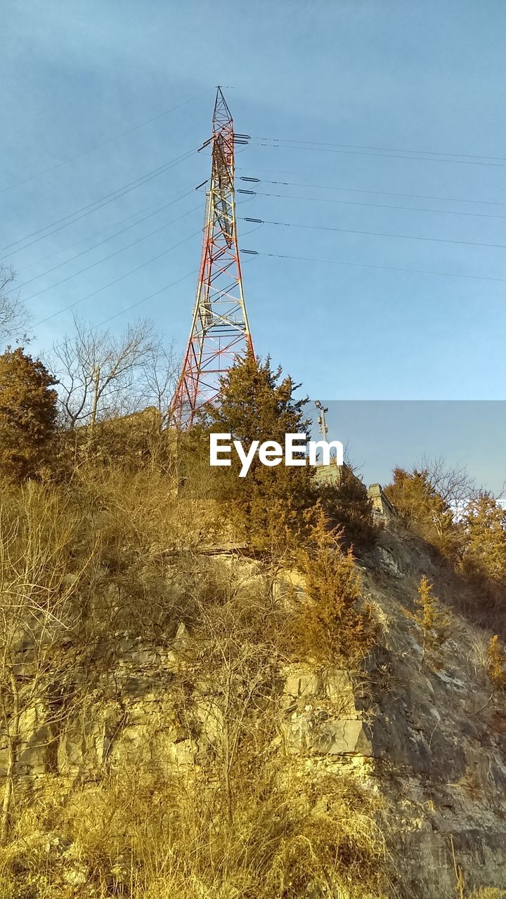 LOW ANGLE VIEW OF WINDMILL AGAINST CLEAR SKY