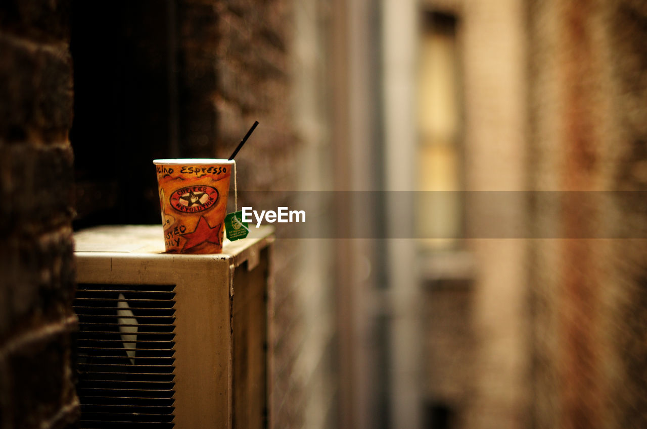 Detail of a glass of coffee in an alley