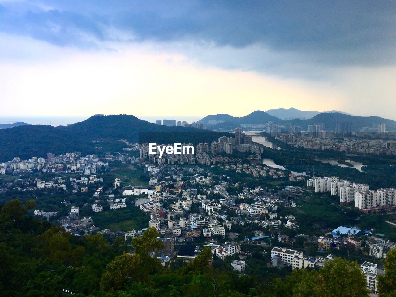 High angle view of buildings in city against sky